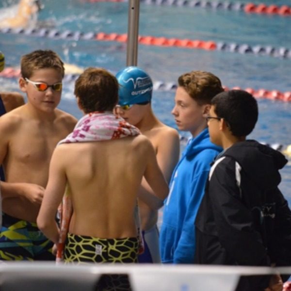 swimming team by pool